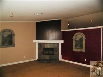 68180 Hermosillo Road Cathedral City, CA 92234 - Photo 3 of 18 view of an empty room with a fireplace