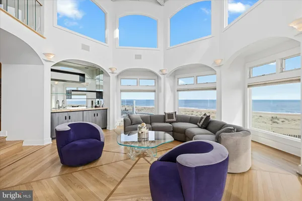a view of a dining room with furniture and a chandelier