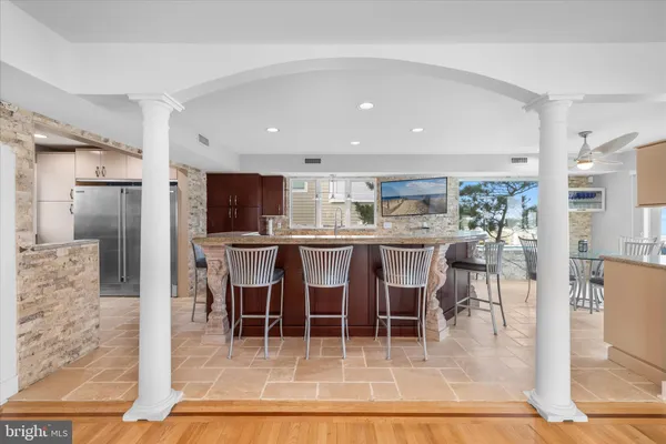 a view of an empty room and wooden floor