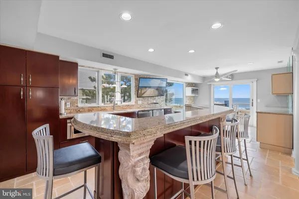 a bathroom with a toilet a sink a mirror and vanity