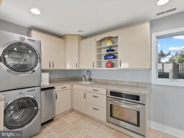 a spacious bathroom with a granite countertop tub sink and mirror