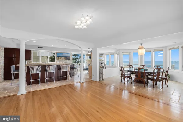 a large spacious bathroom with a granite countertop double vanity sink a mirror and a shower