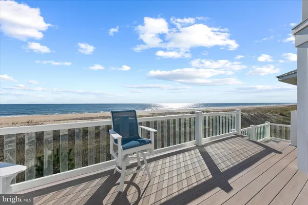 a bathroom with a tub a window and a shower