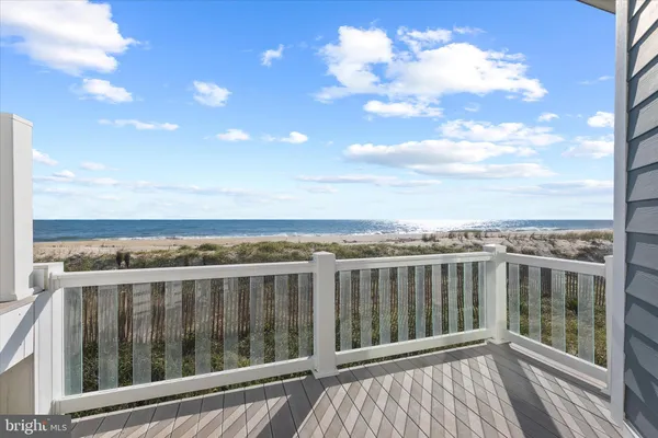 a bathroom with a tub sink shower and mirror