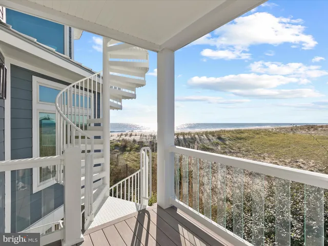 a kitchen with stainless steel appliances kitchen island granite countertop a refrigerator a stove a sink dishwasher with a dining table and chairs