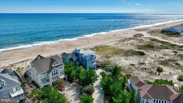 a living room with furniture a clock and a fireplace