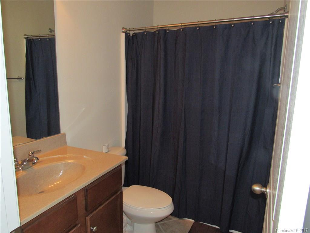 216 Falling Ridge, Unit 148 Belmont, NC 28012 - Photo 14 of 19 a bathroom with a sink and a toilet