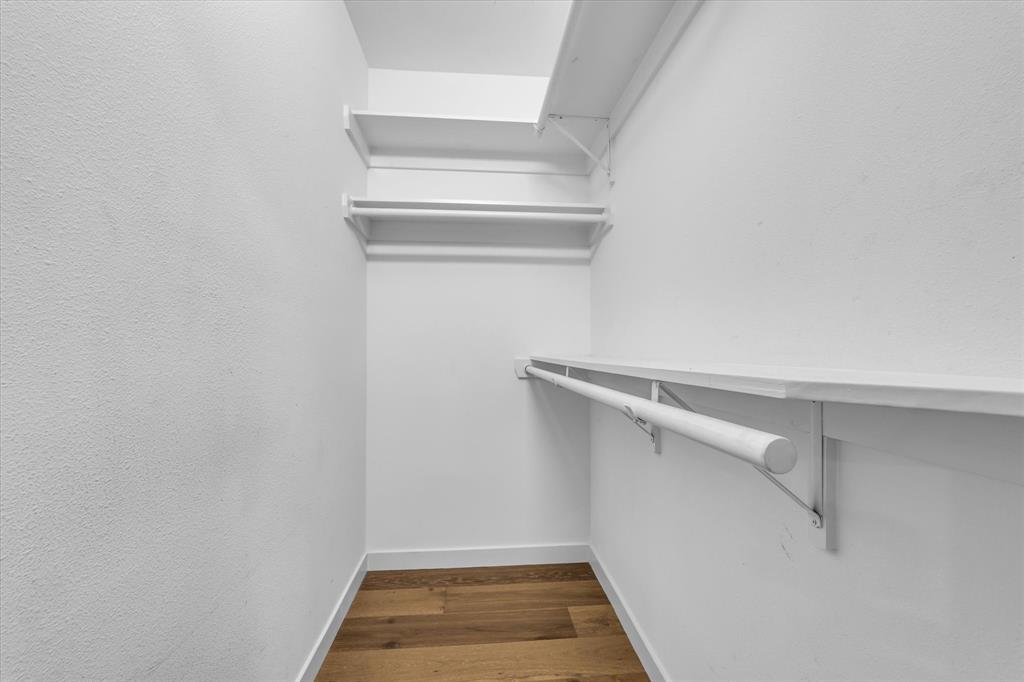 4600 Cedar Mountain Drive Waco, TX 76708 - Photo 18 of 33 a view of walk in closet with empty racks