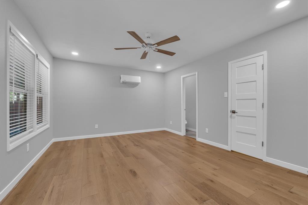 4600 Cedar Mountain Drive Waco, TX 76708 - Photo 23 of 33 wooden floor in an empty room with a window