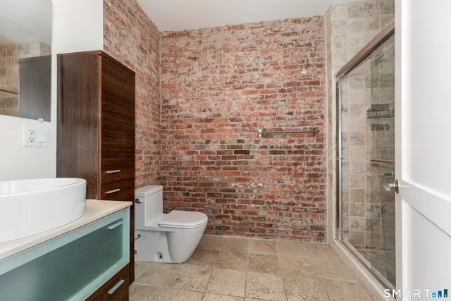 a view of a hallway with washer and dryer