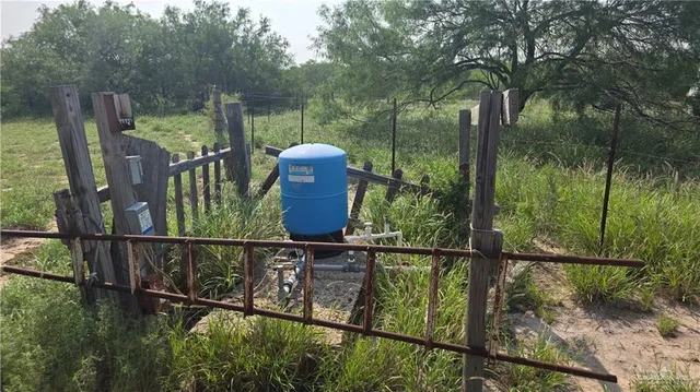 a view of a balcony with yard