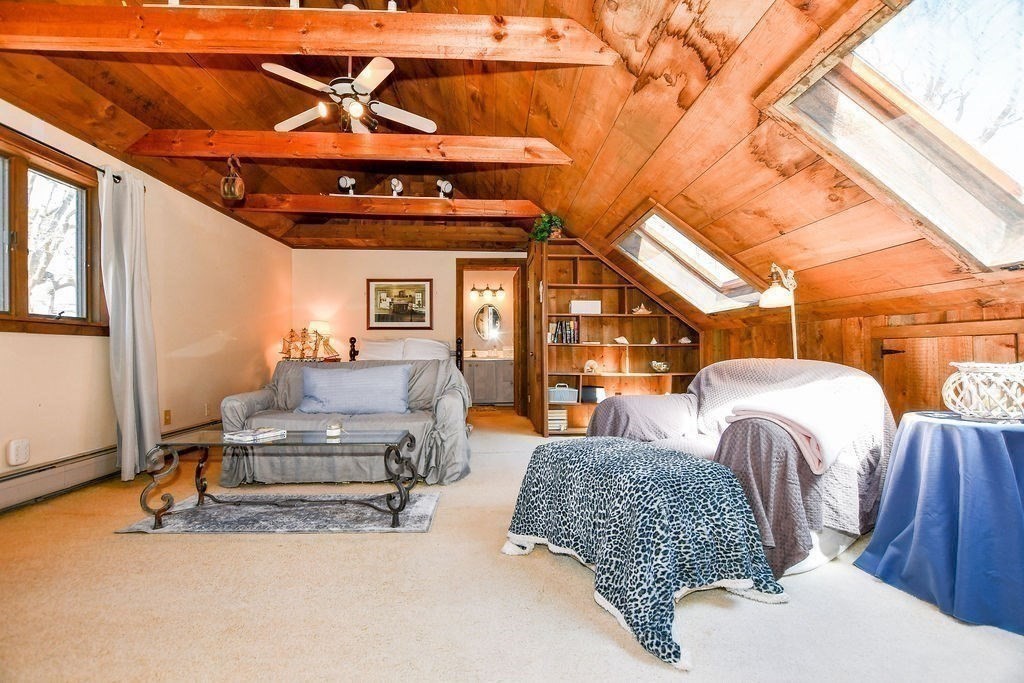 30 Clark Road Bourne, MA 02562 - Photo 19 of 40 a living room with furniture and a fireplace