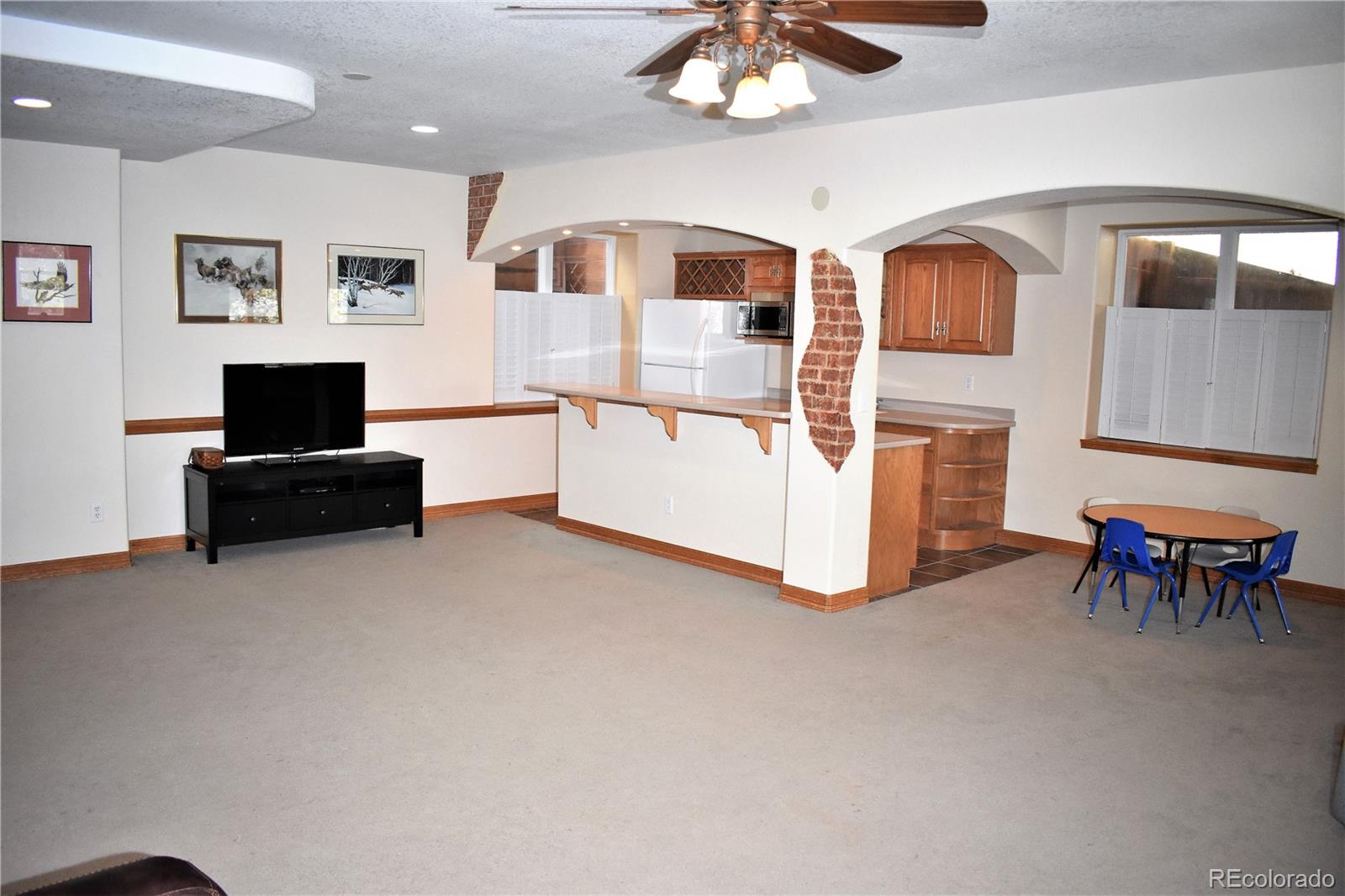 2355 Bricker Road Monument, CO 80132 - Photo 17 of 35 a living room with furniture and a flat screen tv