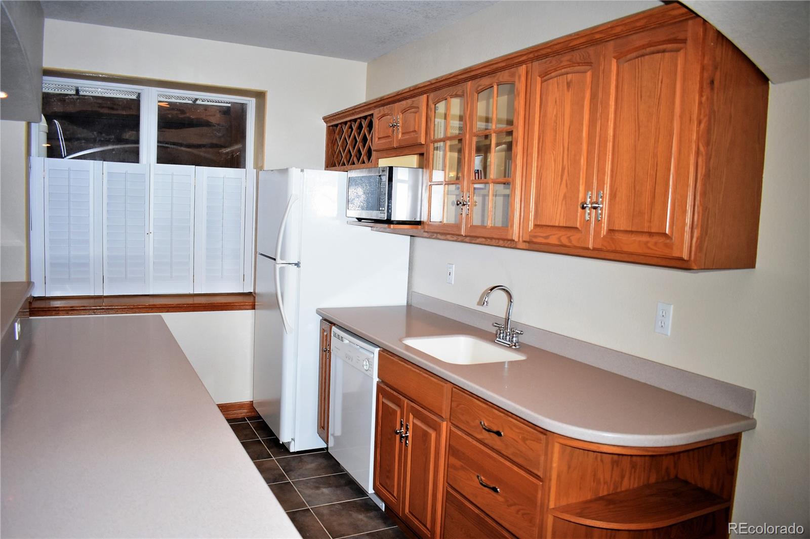 2355 Bricker Road Monument, CO 80132 - Photo 20 of 35 a kitchen with a sink and a microwave