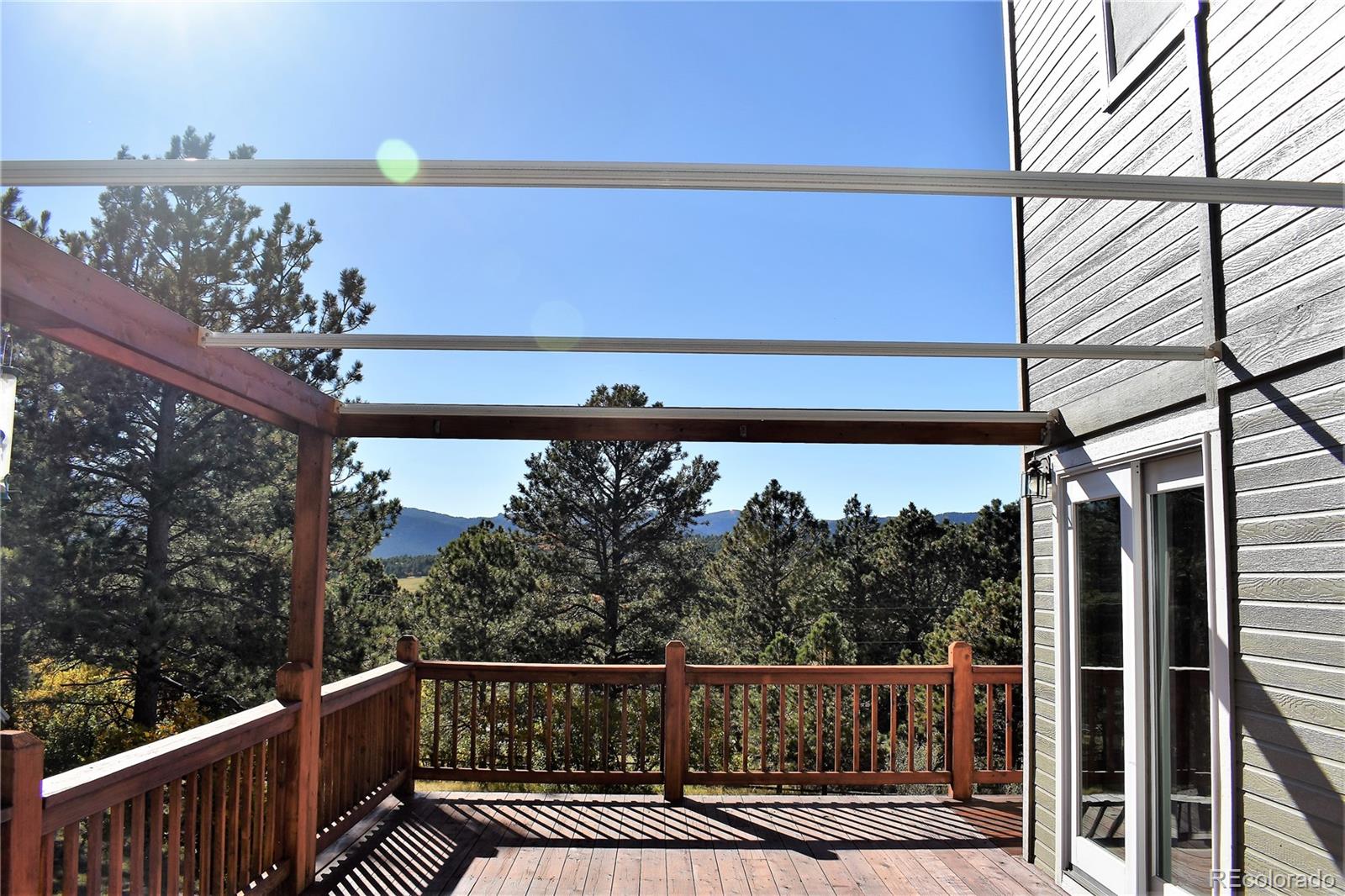 2355 Bricker Road Monument, CO 80132 - Photo 25 of 35 a view of a balcony with wooden floor