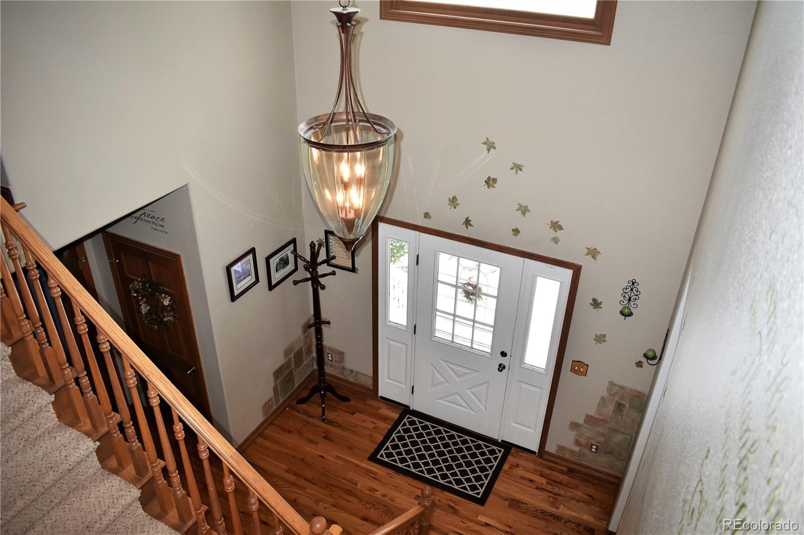 2355 Bricker Road Monument, CO 80132 - Photo 3 of 35 a view of an entryway with wooden floor