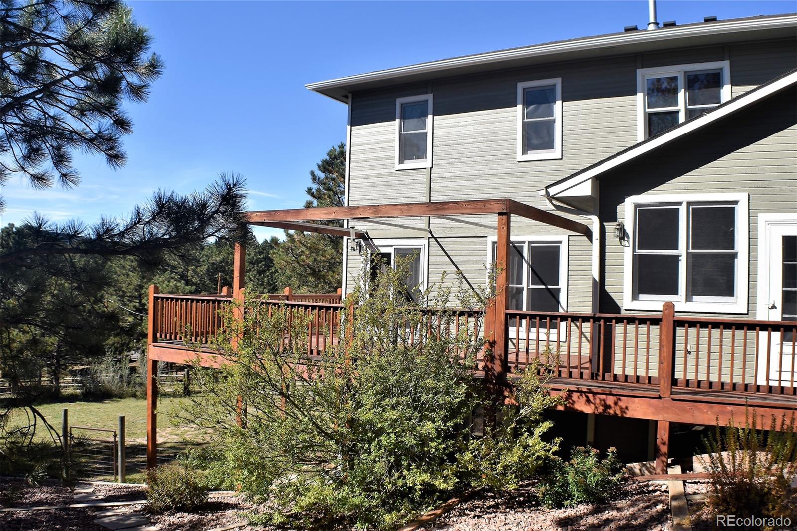 2355 Bricker Road Monument, CO 80132 - Photo 31 of 35 a view of a house with a balcony
