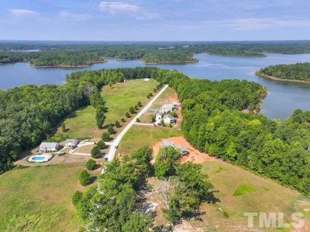 an aerial view of a house with a lake view