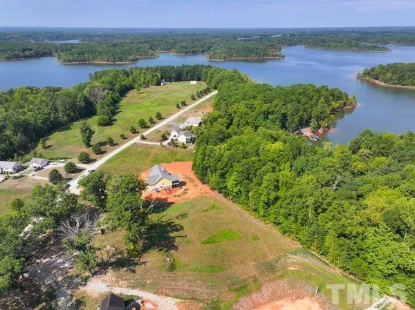 a view of a lake with a yard and green space