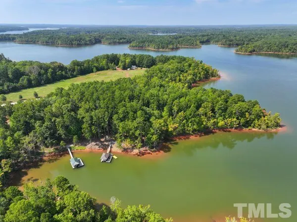 a view of a lake with a yard and lake view