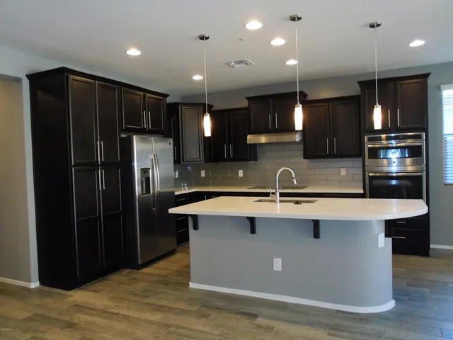 a kitchen with a sink and cabinets