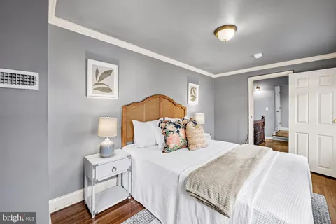 a bedroom with a bed and a lamp