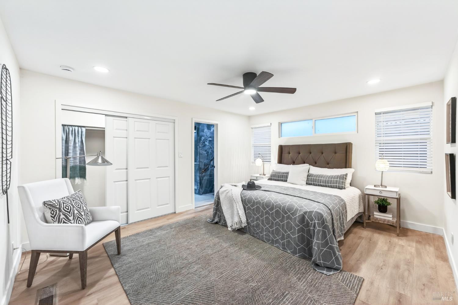 2447 Rigdon Street Napa, CA 94558 - Photo 31 of 79 a bedroom with a bed and a chandelier