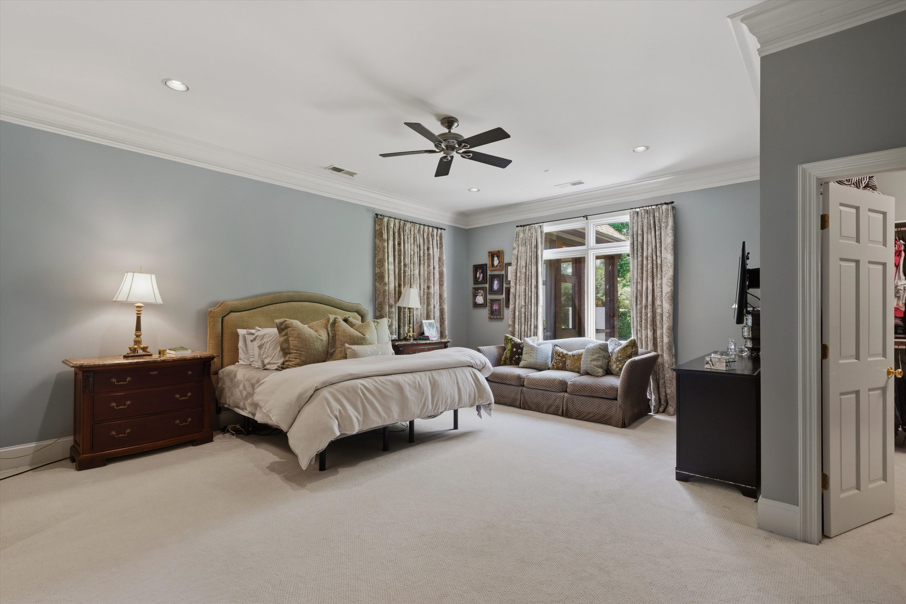 4710 Gwynne Road Memphis, TN 38117 - Photo 20 of 40 a spacious bedroom with a bed and a couch
