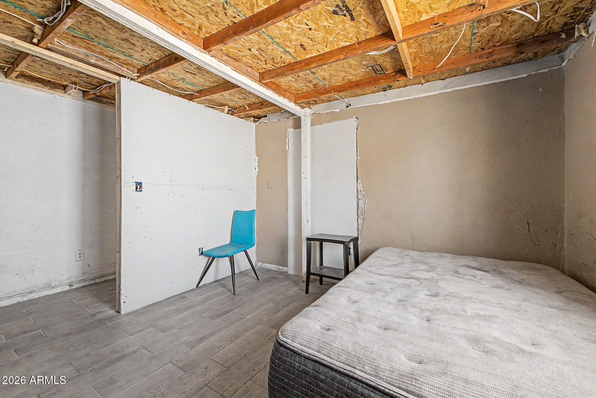 1612 South 5th Street Phoenix, AZ 85004 - Photo 9 of 27 a view of a room with wooden floor and chair