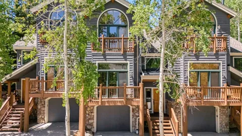 front view of a brick house with a large window