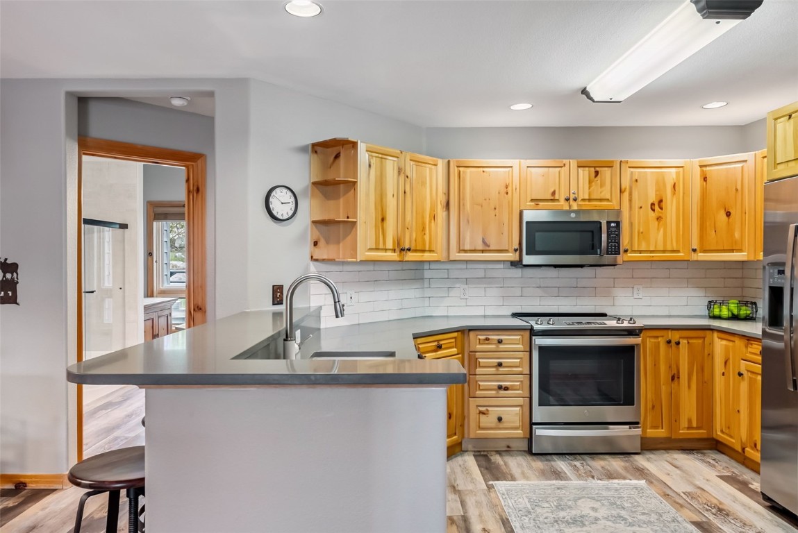434 Kings Crown Road, Unit 434 Breckenridge, CO 80424 - Photo 12 of 50 a kitchen with stainless steel appliances granite countertop a sink and a stove
