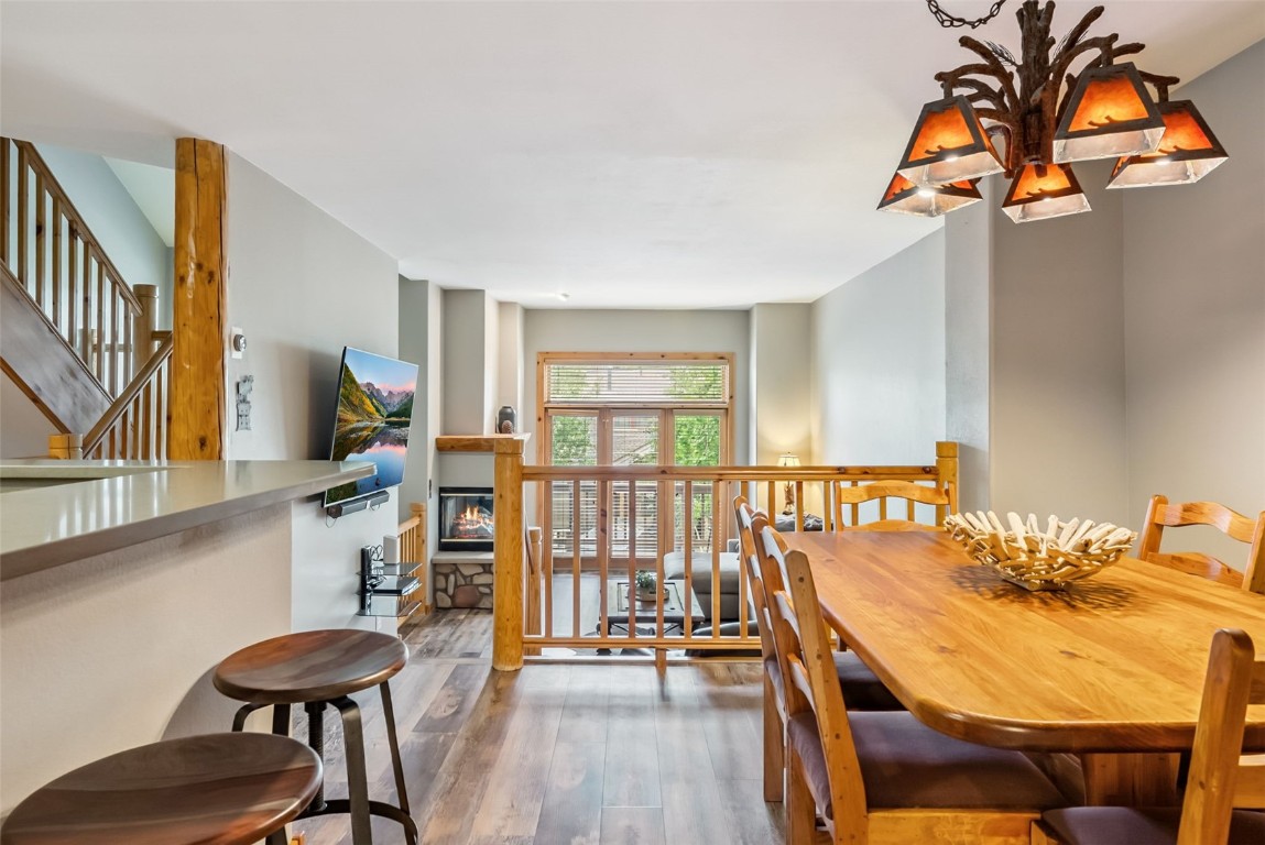 434 Kings Crown Road, Unit 434 Breckenridge, CO 80424 - Photo 17 of 50 a view of a dining room with furniture and wooden floor