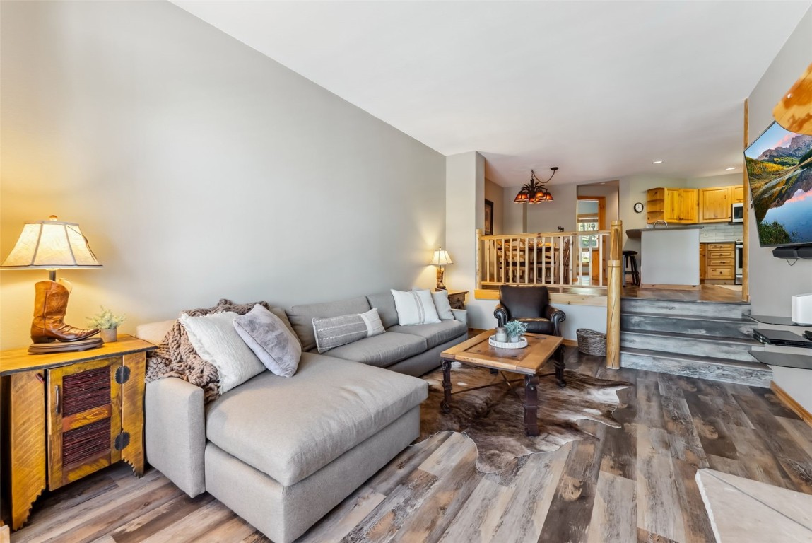 434 Kings Crown Road, Unit 434 Breckenridge, CO 80424 - Photo 2 of 50 a living room with furniture a lamp and a window