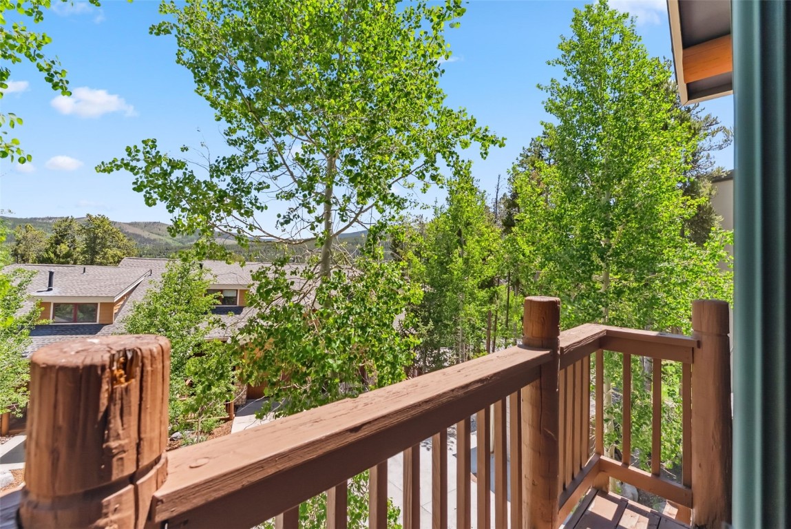 434 Kings Crown Road, Unit 434 Breckenridge, CO 80424 - Photo 32 of 50 a view of a balcony with wooden fence
