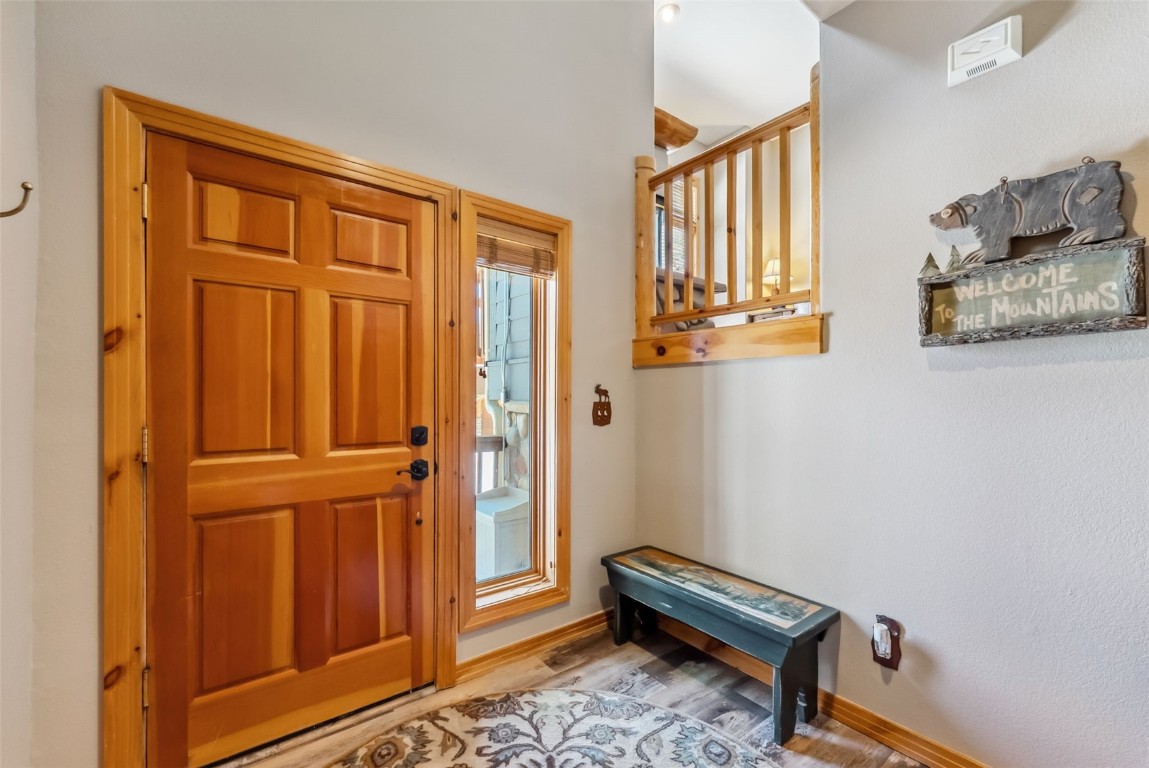 434 Kings Crown Road, Unit 434 Breckenridge, CO 80424 - Photo 33 of 50 a view of a hallway with windows and stairs