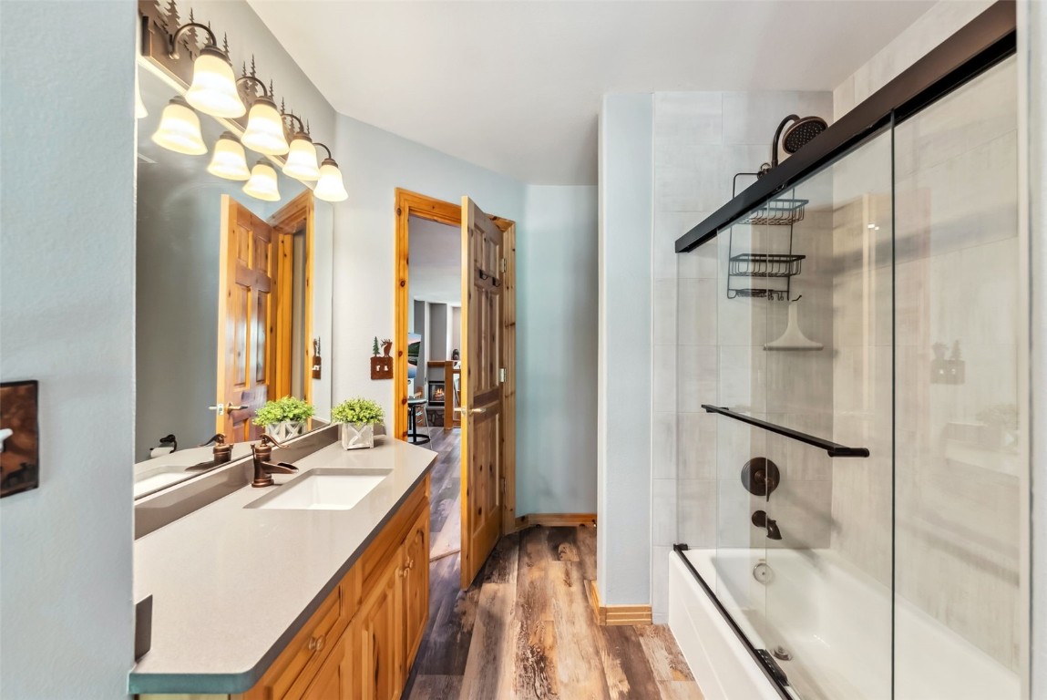 434 Kings Crown Road, Unit 434 Breckenridge, CO 80424 - Photo 36 of 50 a bathroom with a double vanity sink a mirror and a bathtub