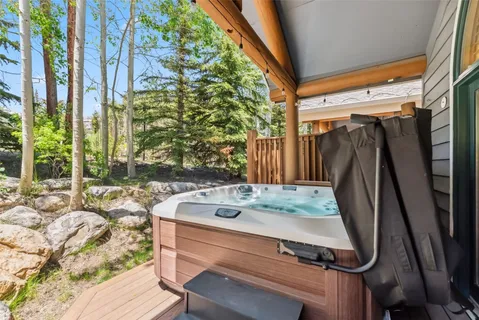 a bath tub sitting in a bathroom next to a window