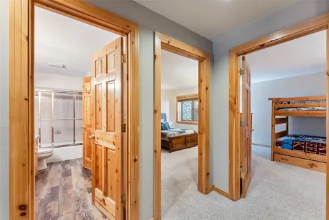 a en suite bathroom with a tub shower and a sink