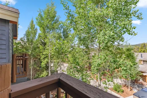 a view of a balcony with a tree