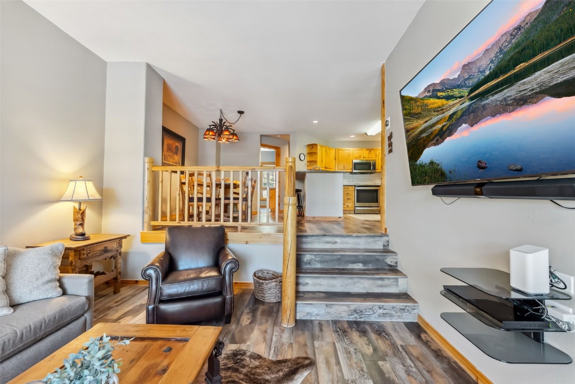 434 Kings Crown Road, Unit 434 Breckenridge, CO 80424 - Photo 8 of 50 a living room with furniture and a wooden floor