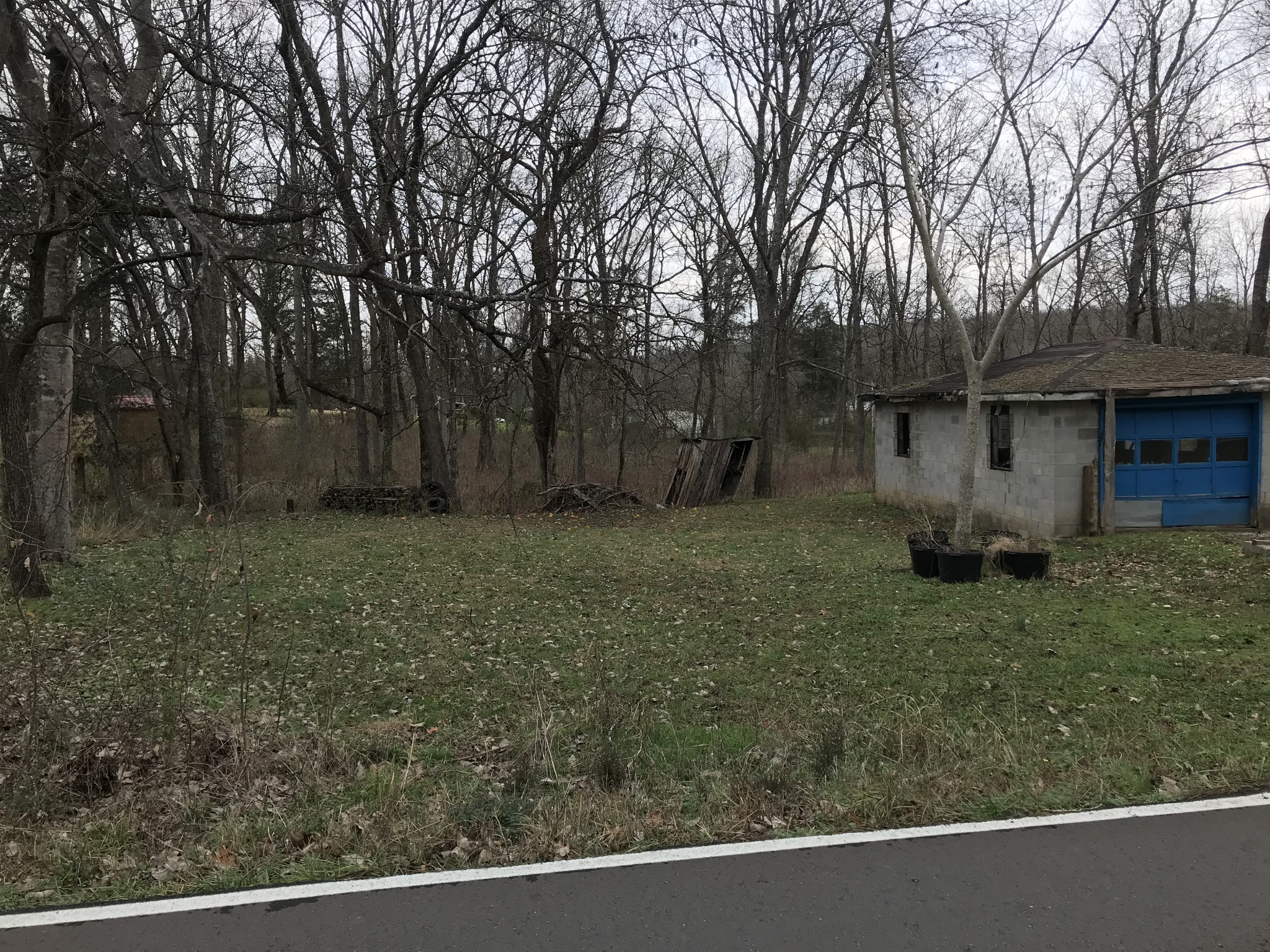 211 Ramsey Road Lebanon, TN 37087 - Photo 9 of 17 a view of a barn in the middle of a yard
