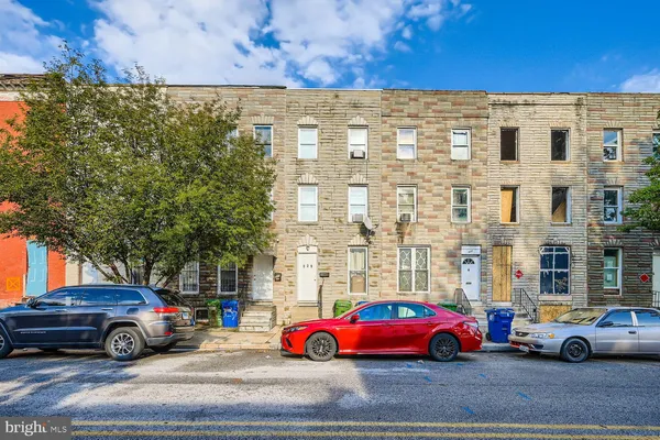 a cars parked in front of a building