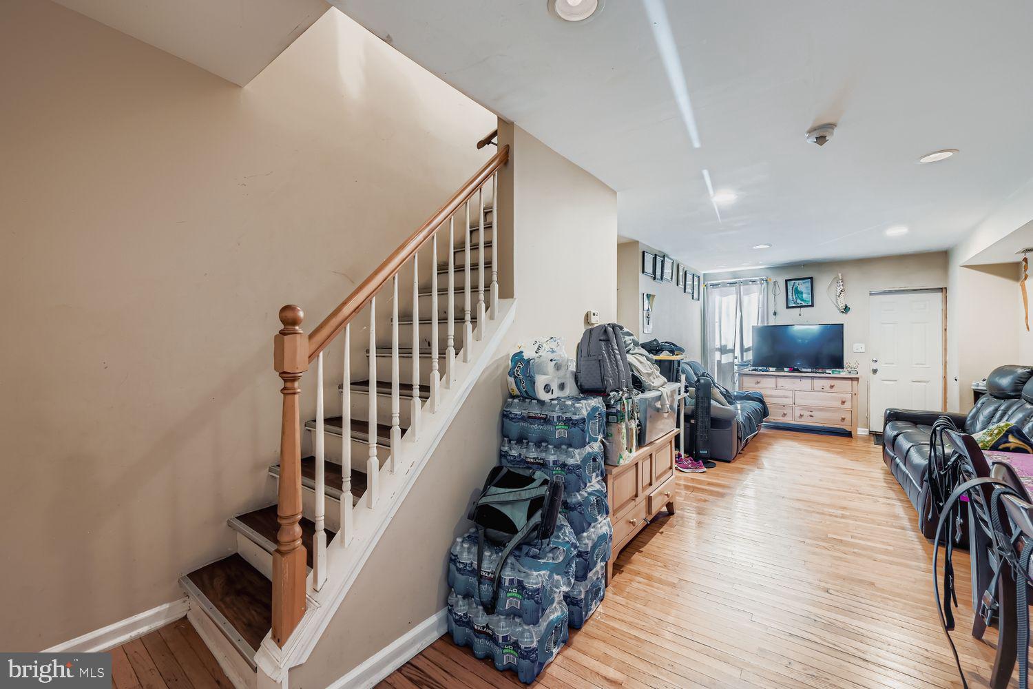 329 South Gilmor Street Baltimore, MD 21223 - Photo 13 of 28 a view of entryway livingroom and hall with wooden floor