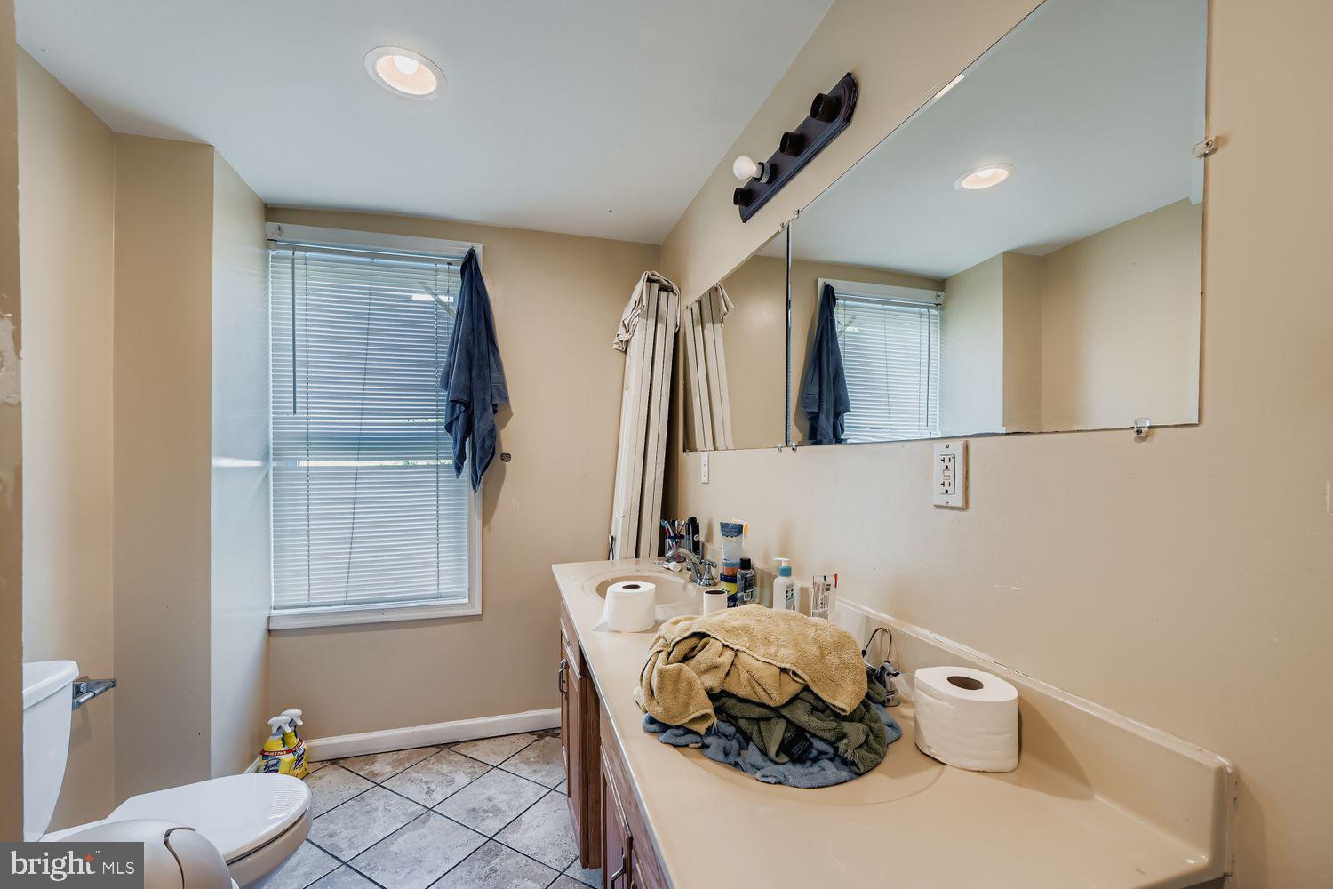 329 South Gilmor Street Baltimore, MD 21223 - Photo 16 of 28 a bathroom with a sink and a mirror