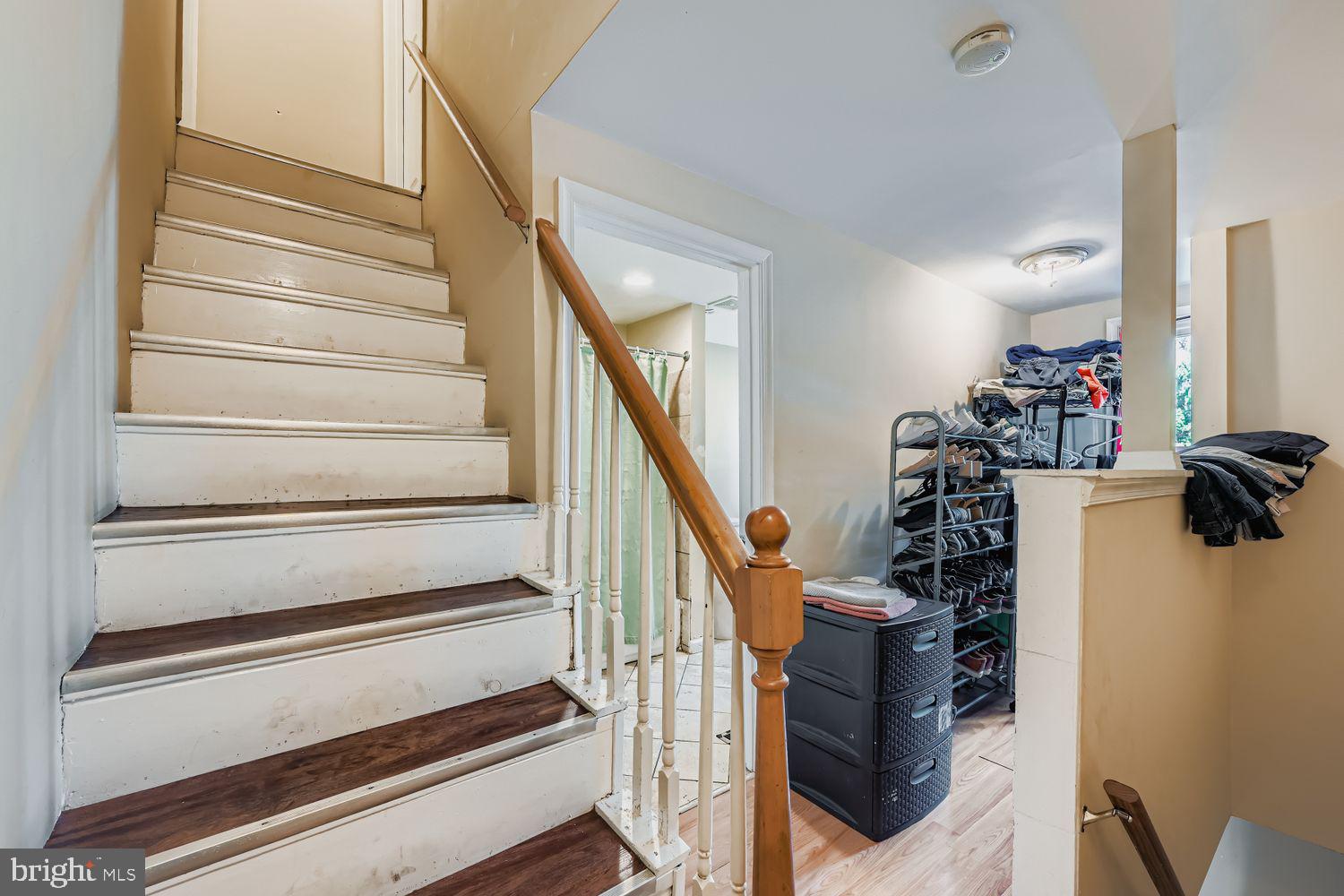 329 South Gilmor Street Baltimore, MD 21223 - Photo 18 of 28 a view of staircase with wooden floor and stairs