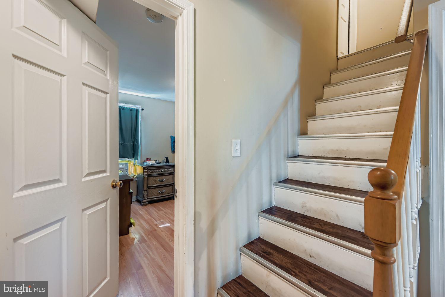 329 South Gilmor Street Baltimore, MD 21223 - Photo 19 of 28 a view of staircase with wooden floor and staircase