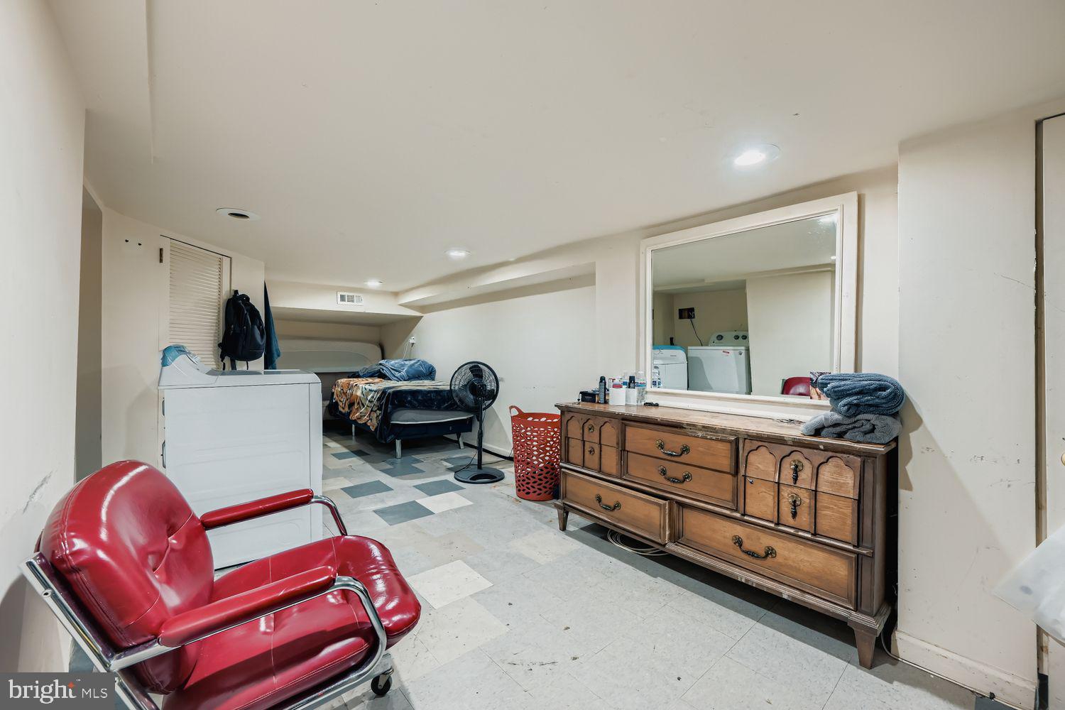 329 South Gilmor Street Baltimore, MD 21223 - Photo 23 of 28 a room with furniture a flat screen tv and a dresser