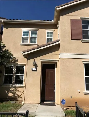 a front view of a house with garage