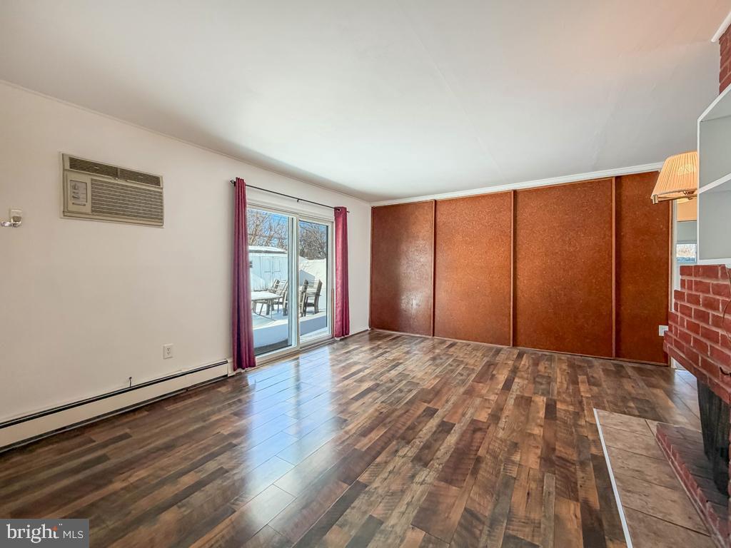 19 Butterfly Lane Levittown, PA 19054 - Photo 15 of 32 a big room with wooden floor and windows