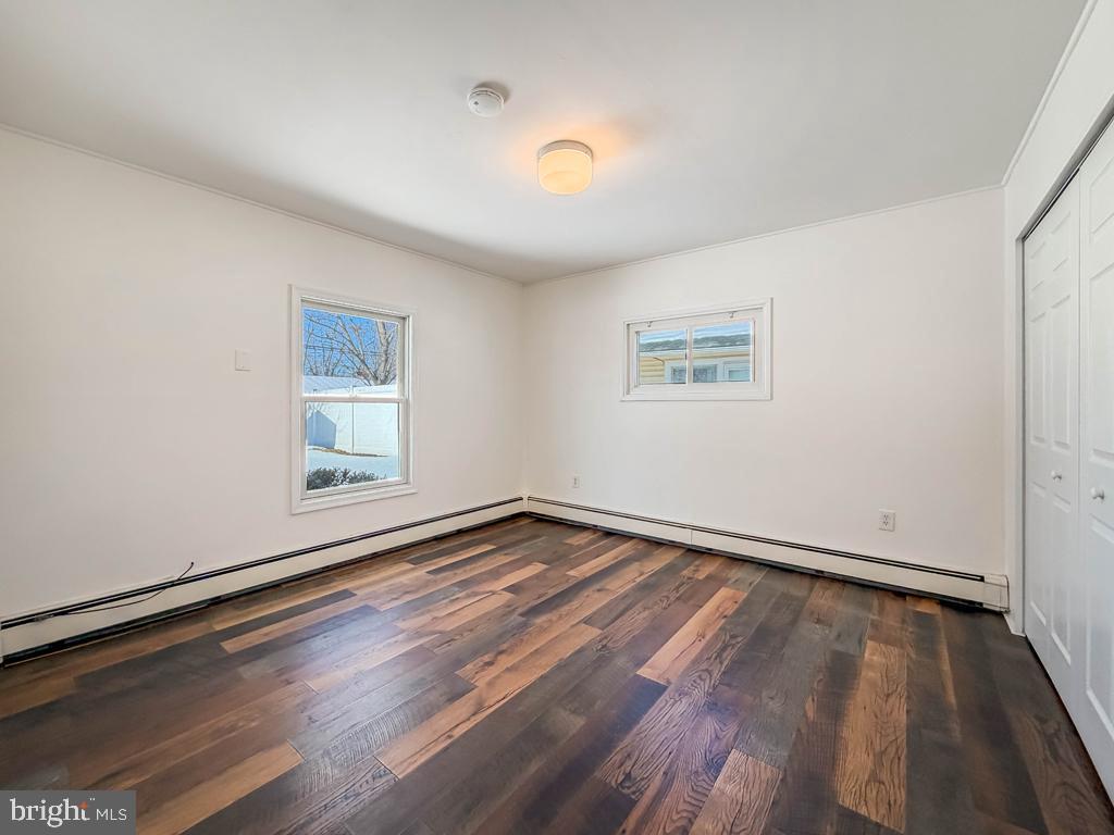 19 Butterfly Lane Levittown, PA 19054 - Photo 22 of 32 wooden floor in an empty room with a window